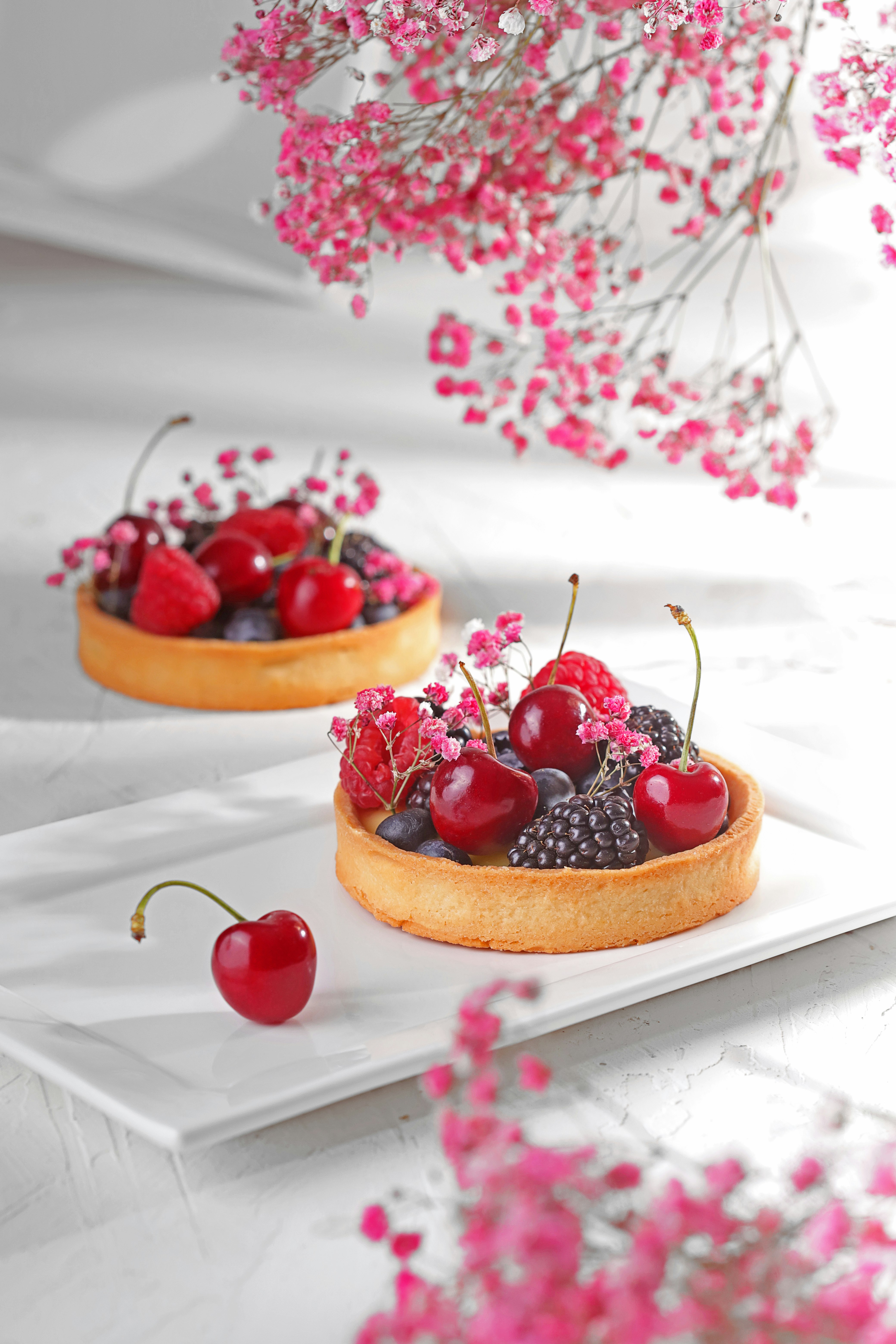 red and black berries on brown bread